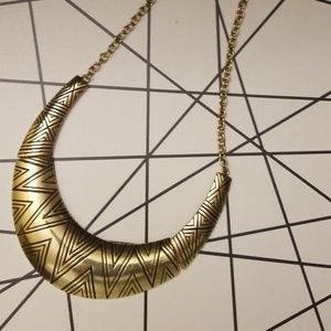 A gold Egyptian style necklace